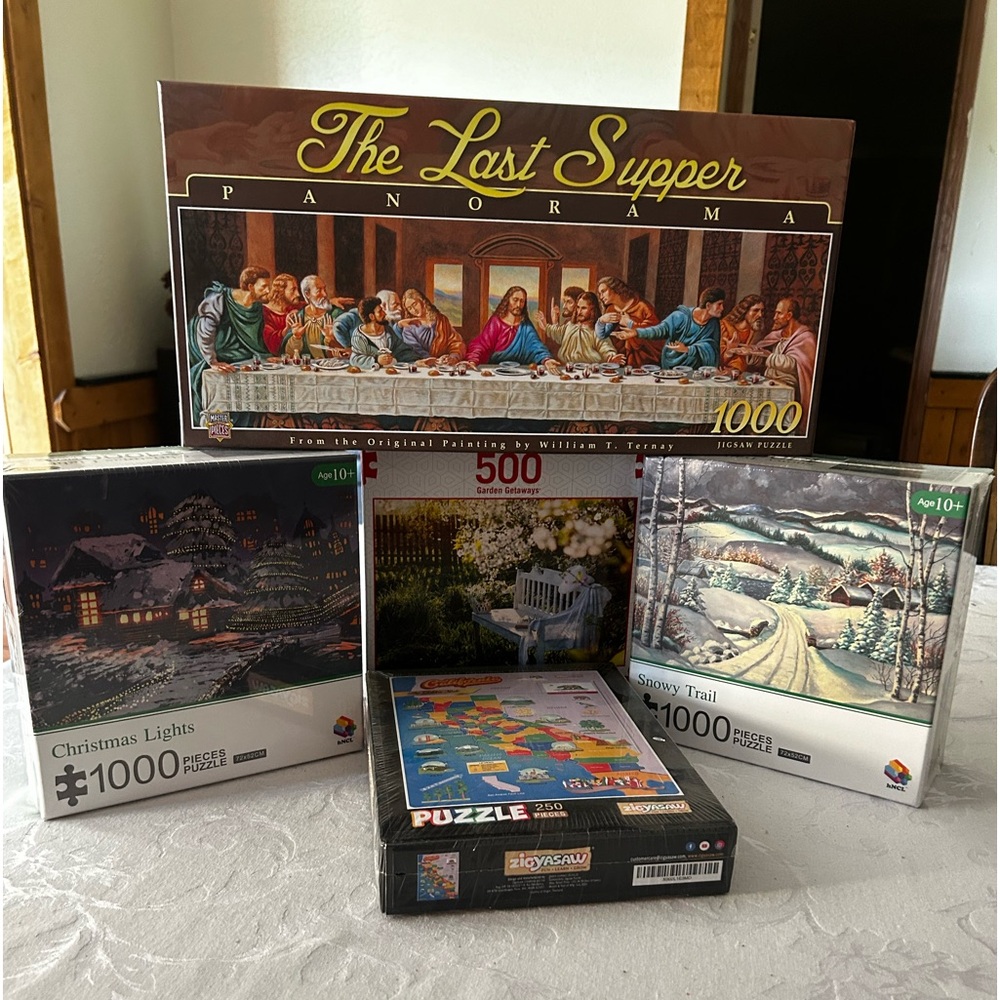 5 Brand new puzzles still sealed.
